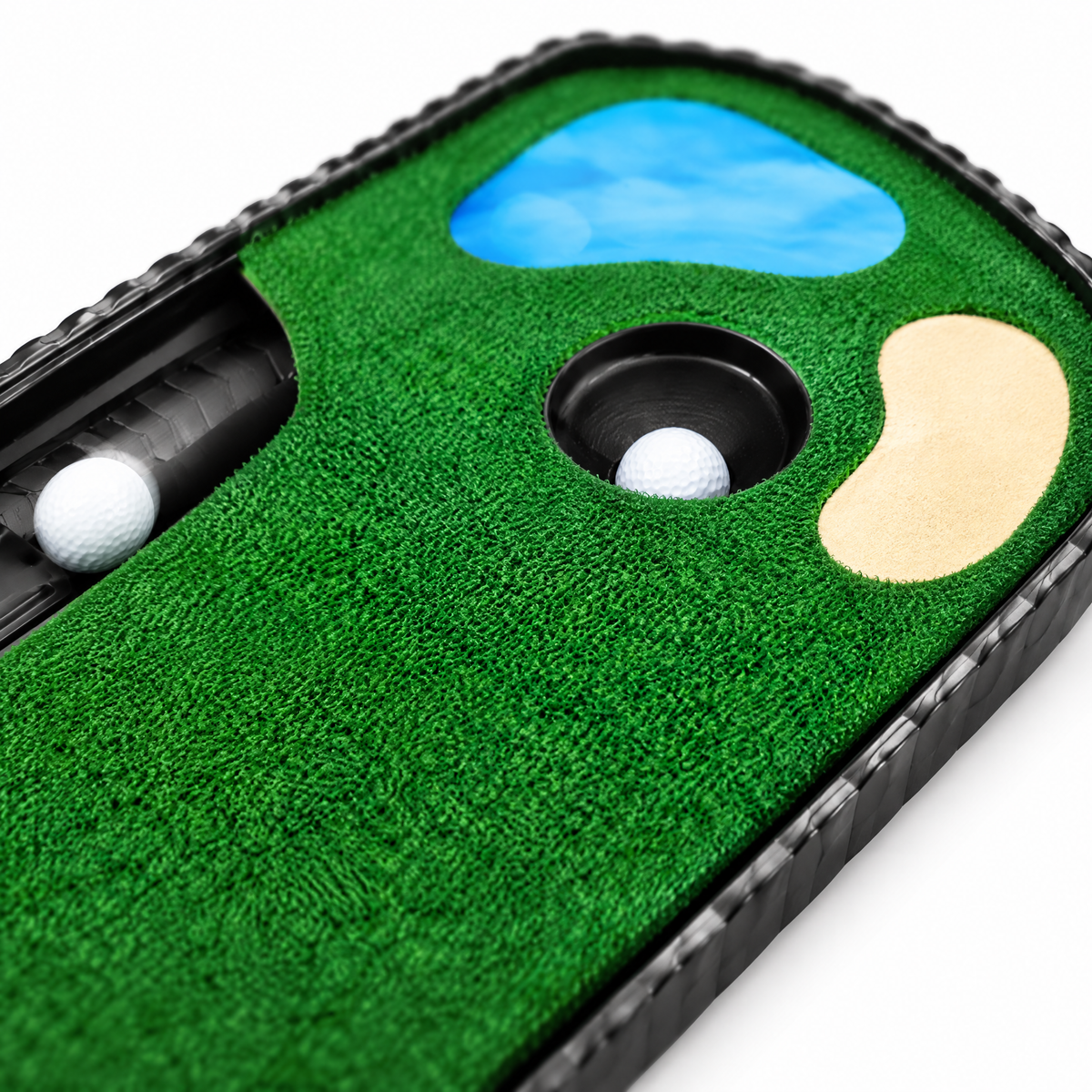 Close-up of the putting mat cup and automatic ball return channel